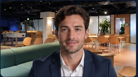 A speaker's camera feed with a virtual office background applied